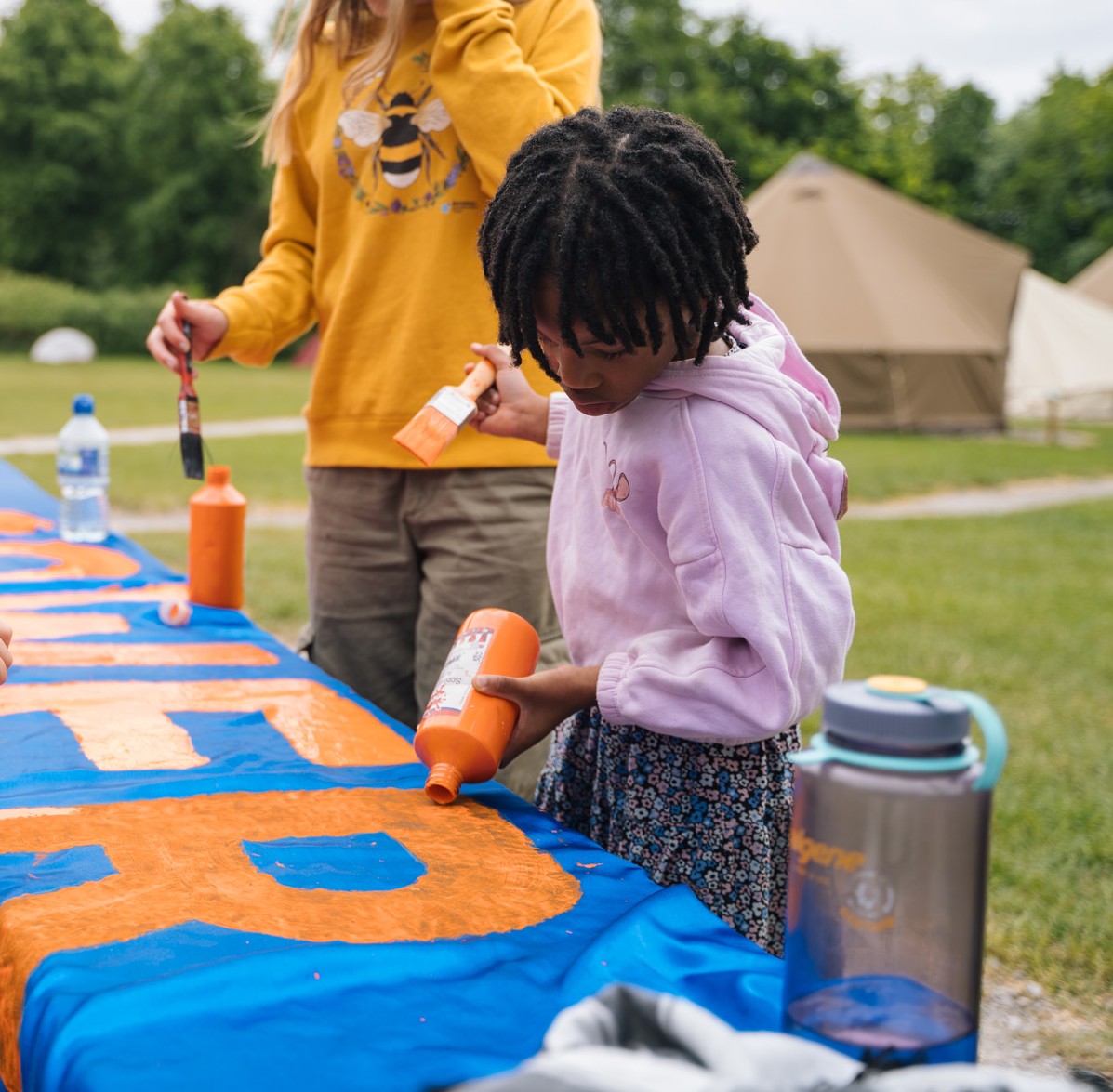 Worker power banner making at WCW25