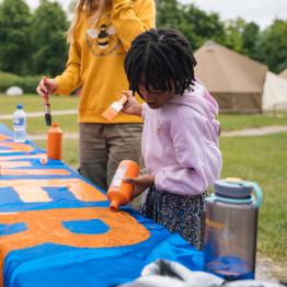 Worker power banner making at WCW25